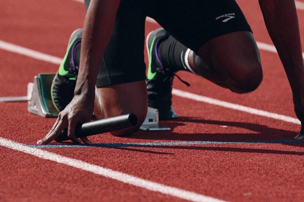 Athletics and Team Spirit – Victory College Extracurricular Activities athlete, runner, sprint, fast, black, man, black man, person, racetrack, relay, sport, sports wear, start, athlete, runner, sport, sport, start, start, start, start, start