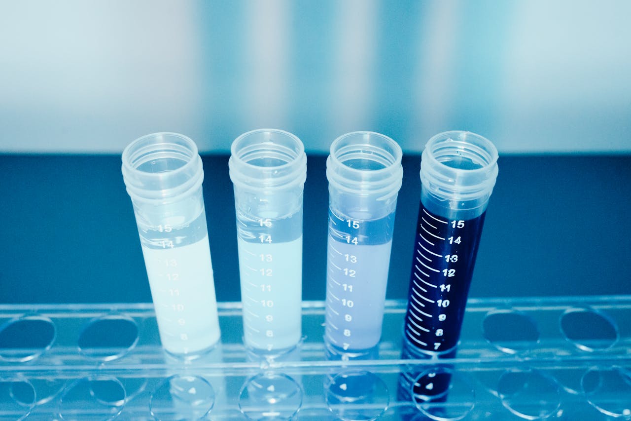Close-up of colorful test tubes in a laboratory setting for medical and scientific research.